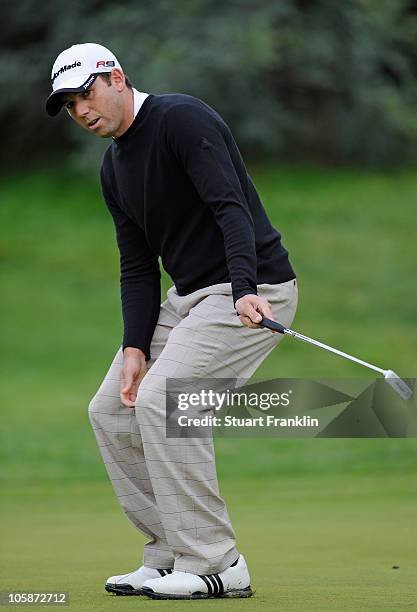 Sergio Garcia of Spain preacts to his putt on the 12th hole during the first round of the Castello Masters Costa Azahar at the Club de Campo del...