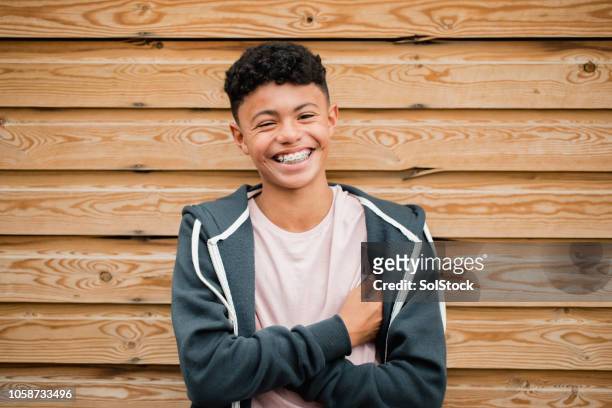 headshot of a teenage boy - braces imagens e fotografias de stock