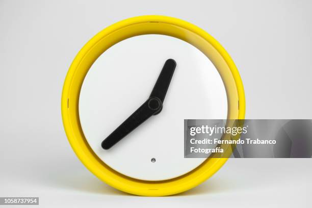 yellow clock - lancetta dei minuti foto e immagini stock