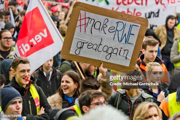 Make RWE great again' is written on a poster of a worker who takes part in a demonstration of coal miners and electricity plant workers of the RWE...