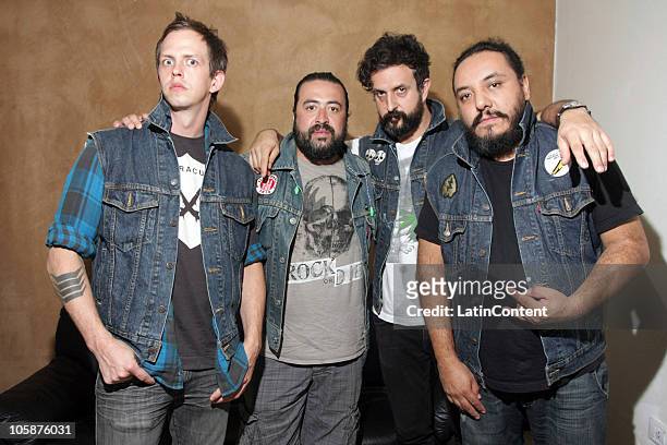 Randy Ebright, Micky Huidobro, Tito Fuentes and Paco Ayala of the Mexican band Molotov pose for a photograph at the backstage before their concert at...