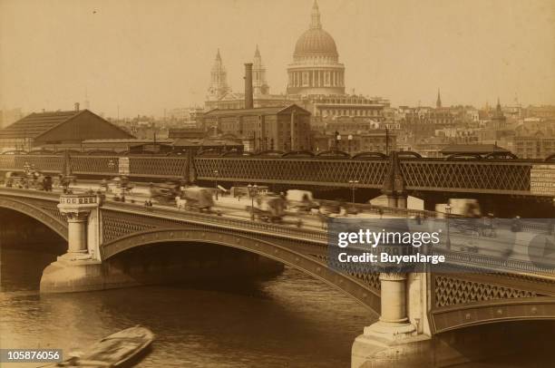 View of carriage and pedestrian traffic on the Blackfriars Bridge with St. Paul's Cathedral in the background, London, 1888.