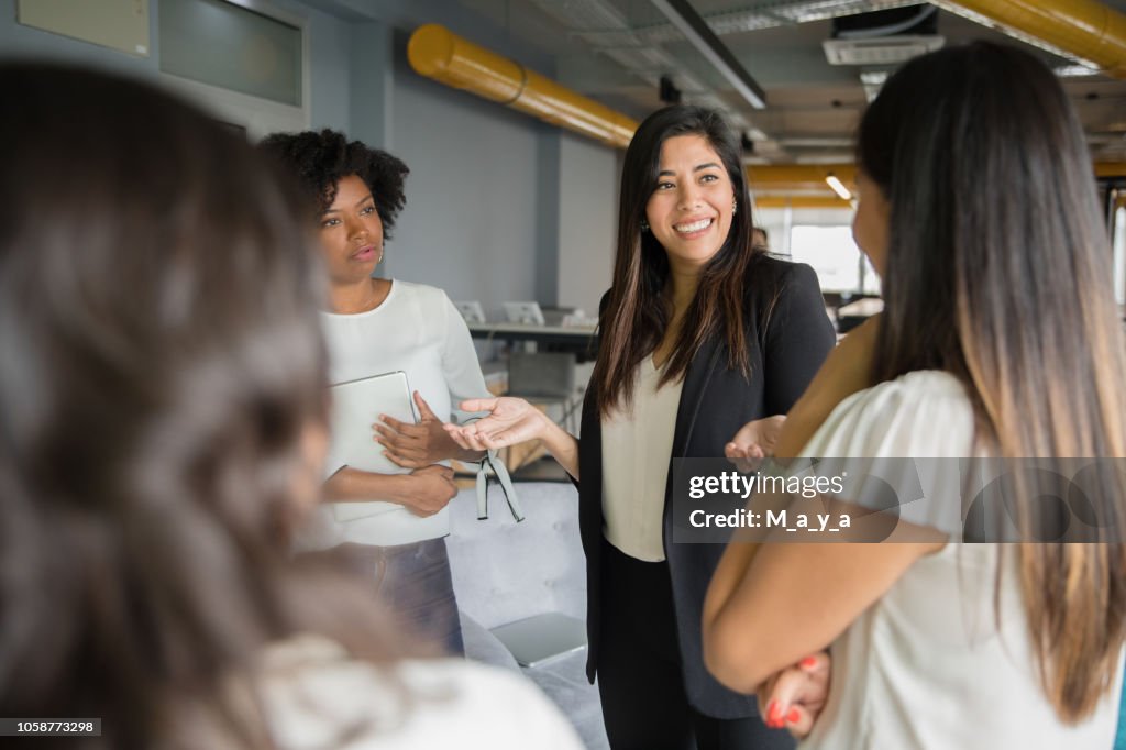 Group of women having informal conversation