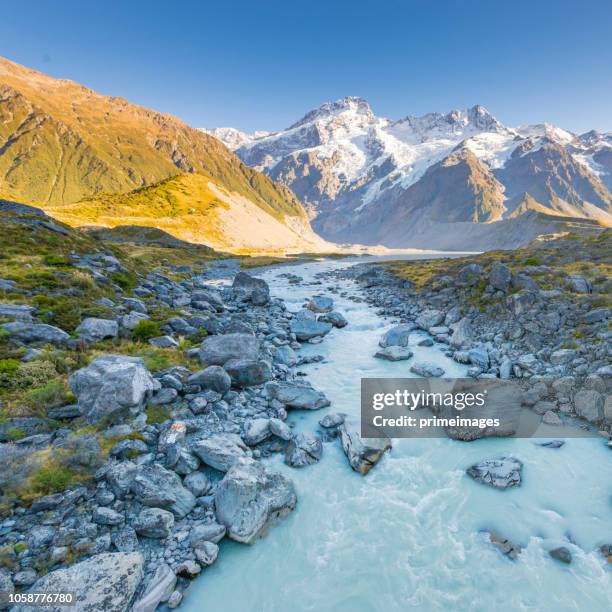 young traveler taking photo at mt cook famaus destination in new zealand - otago landscape stock pictures, royalty-free photos & images