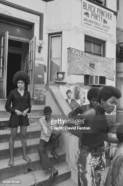 View of the front stoop, occupied by several women, of the Black Panther Party's Washington Chapter community information center , Washington DC,...