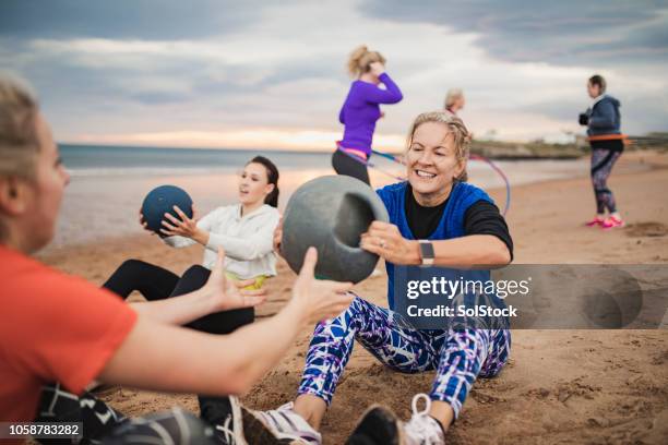 mature woman doing weighted ball exercises - gym no people stock pictures, royalty-free photos & images