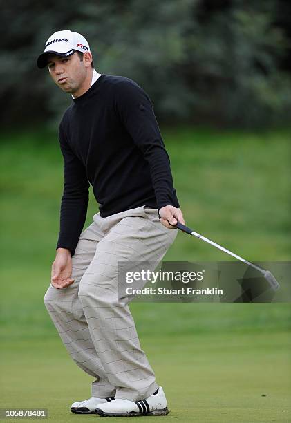 Sergio Garcia of Spain preacts to his putt on the 12th hole during the first round of the Castello Masters Costa Azahar at the Club de Campo del...