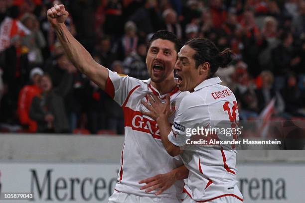Ciprian Marica of Stuttgart celebrates scoring his first team goal with his team mate Mauro Camoranesi during the UEFA Europa League group H match...