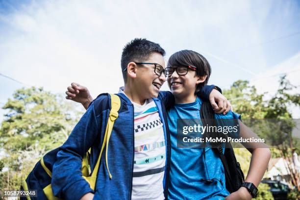 school age brothers laughing outdoors - 12 year old cute boys stock pictures, royalty-free photos & images