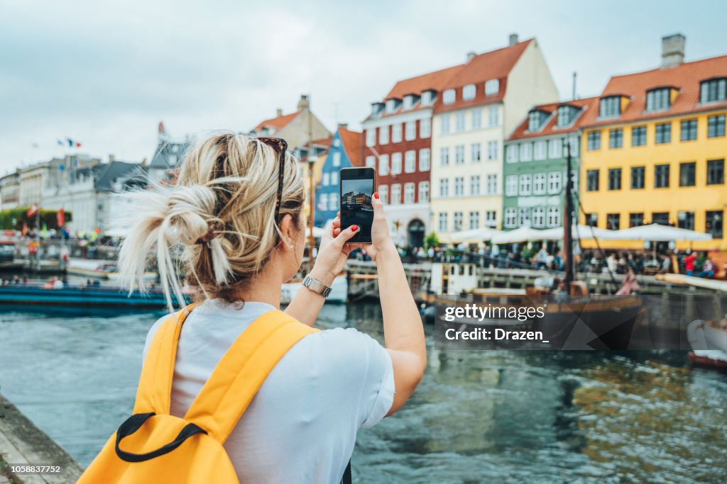 Traveling to Copenhagen - tourist in Nyhavn