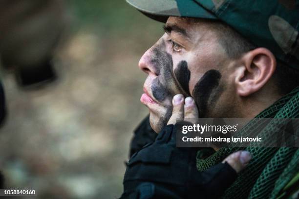 war camouflage - face painting stock pictures, royalty-free photos & images