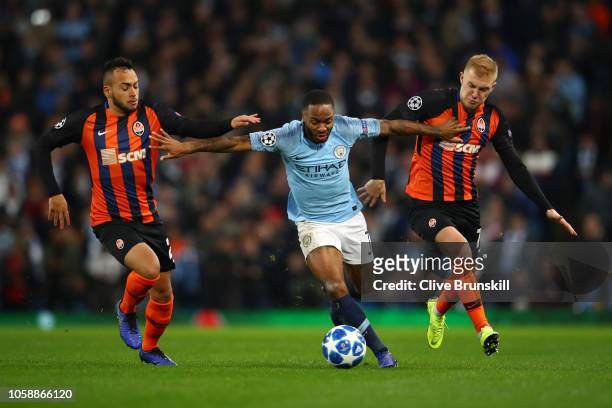 Raheem Sterling of Manchester City is challenged by Maycon of Shakhtar Donetsk and Viktor Kovalenko of Shakhtar Donetsk during the Group F match of...
