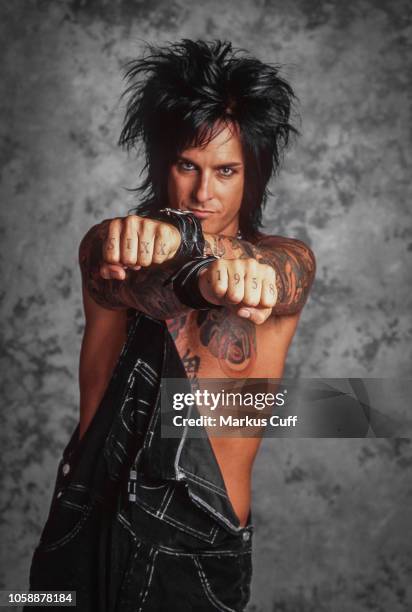 Motley Crue bassist Nikki Sixx poses for a tattoo related session in Los Angeles on April 25, 1997.