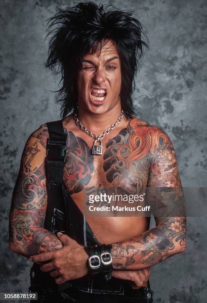 Motley Crue bassist Nikki Sixx poses for a tattoo related session in Los Angeles on April 25, 1997.