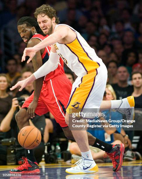 The Los Angeles Lakers' Pau Gasol is fouled by the Atlanta Hawks' DeMarre Carroll at Staples Center in Los Angeles, CA on November 2, 2013.