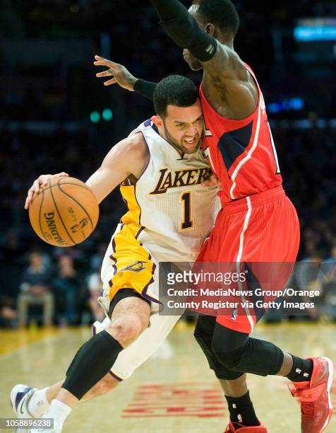 The Los Angeles Lakers' Jordan Farmar tries to get past the Atlanta Hawks' Dennis Schroder at Staples Center in Los Angeles, CA on November 2, 2013.