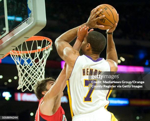 The Los Angeles Lakers' Xavier Henry takes a hand to the face from the Atlanta Hawks' Kyle Korver at Staples Center in Los Angeles, CA on November 2,...