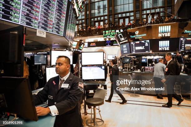 Traders work on the floor of the New York Stock Exchange on the evening of November 7, 2018 in New York City. Stocks rose over 500 points the day...