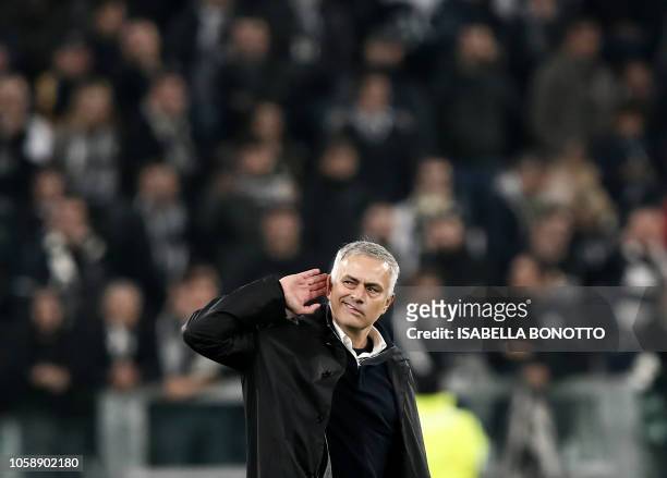 Manchester United's Portuguese manager Jose Mourinho gestures towards the public at the end of the UEFA Champions League group H football match...