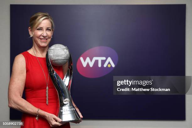 Chris Evert poses with the WTA World Number One singles trophy named in her honor on Day 8 of the BNP Paribas WTA Finals Singapore presented by SC...