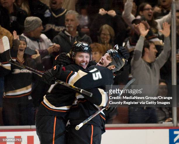 The Ducks' Ryan Getzlaf, right, celebrates with teammate Hampus Lindholm after Getzlaf scored with five seconds left in overtime against the Tampa...