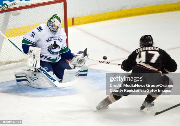 The Ducks' Hampus Lindholm can't get this puck past Vancouver Canucks goalie Eddie Lack during their game at Honda Center in Anaheim on November 10,...