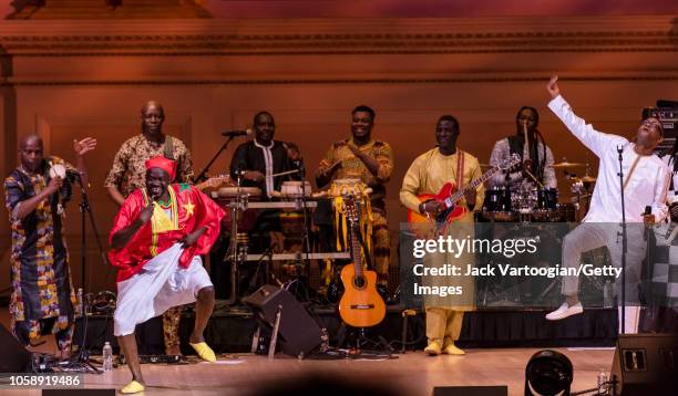 Senegalese dancer Moussa Sonko performs with Youssou N'Dour and his band, le Super Etoile de Dakar, at Carnegie Hall, New York, New York, October 20,...