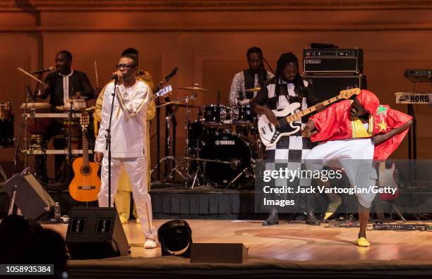 Senegalese singer and composer Youssou N'Dour performs with his band, le Super Etoile de Dakar, including dancer Moussa Sonko at Carnegie Hall, New...