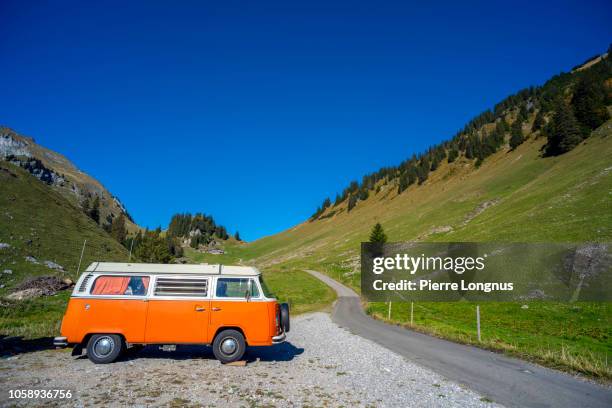 old school vw camper in the gruyere mountains - vw kombi stock pictures, royalty-free photos & images