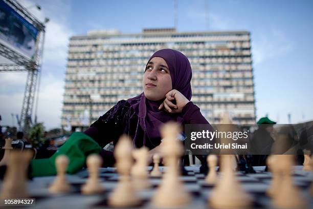 An Israeli Arab chess player waits for Israeli Grandmaster Alik Gershon, during an attempt to break the Guinness world record of simultaneous chess...