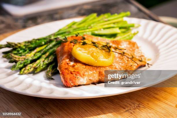 grilled salmon on a plate with asparagus - ketogenic diet stock pictures, royalty-free photos & images