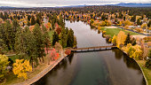 Looking down on Mirror Pond on the Deschutes River in Bend Oregon lined with autumn colored trees