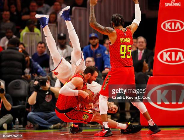 Miles Plumlee of the Atlanta Hawks battles for a rebound against Enes Kanter of the New York Knicks at State Farm Arena on November 7, 2018 in...