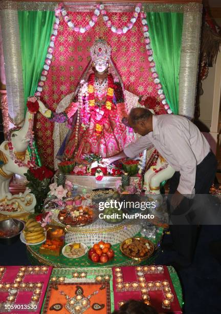 Hindu devotees perform Lakshmi puja during the festival of Diwali at a Hindu temple in Toronto, Ontario, Canada on November 7, 2018. Lakshmi is the...