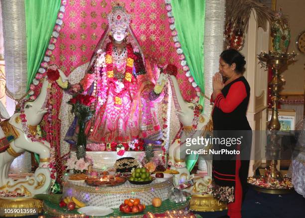 Hindu devotees perform Lakshmi puja during the festival of Diwali at a Hindu temple in Toronto, Ontario, Canada on November 7, 2018. Lakshmi is the...