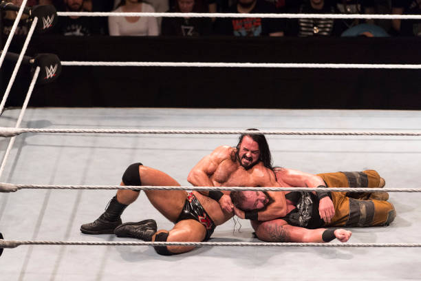 Drew McIntyre competes in the ring against Braun Strowman during the WWE Live Show at Lanxess Arena on November 7, 2018 in Cologne, Germany.