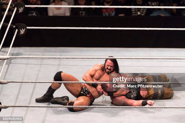 Drew McIntyre competes in the ring against Braun Strowman during the WWE Live Show at Lanxess Arena on November 7, 2018 in Cologne, Germany.