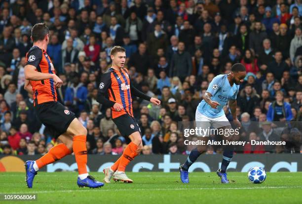 Raheem Sterling of Manchester City kicks the turf and trips over to be awarded a penalty during the UEFA Champions League Group F match between...