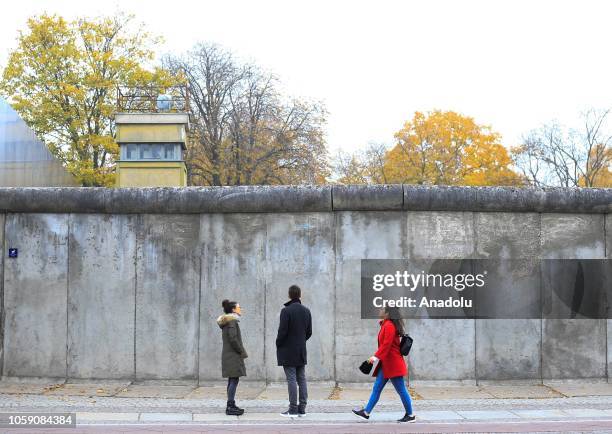 People visit the wall on the Bernauer Street on on the 29th anniversary of the fall of the Berlin Wall in Berlin, Germany on November 8, 2018....