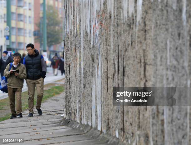 People visit the wall on the Bernauer Street on on the 29th anniversary of the fall of the Berlin Wall in Berlin, Germany on November 8, 2018....