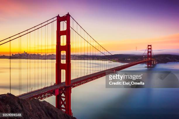 long exposure before sunrise in golden gate bridge, san francisco, usa - san francisco stock pictures, royalty-free photos & images