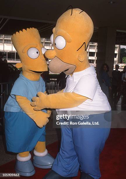 Bart Simpson and Homer Simpson during Premiere of "FernGully: The Last Rainforest" at Cineplex Odeon Theater in Century City, California, United...