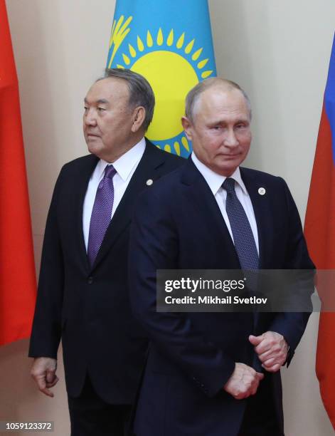 Russian President Vladimir Putin and Kazakh President Nursultan Nazarbayev enter the hall during the Session of the Council on Collective Security of...