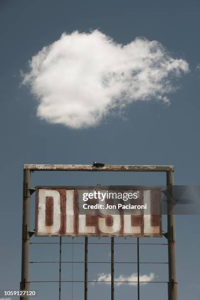 abandoned diesel gas station signage - diesel-kraftstoff stock-fotos und bilder
