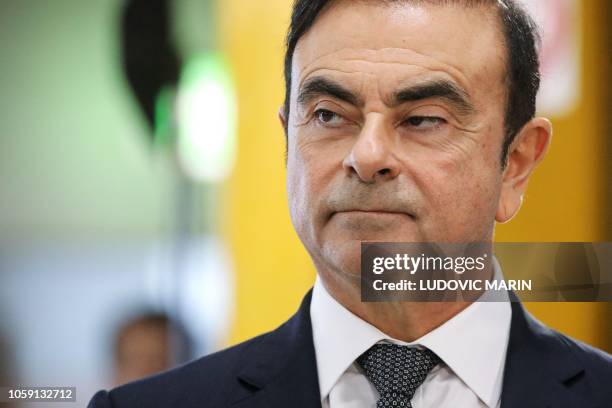 Chairman and CEO of Renault-Nissan-Mitsubishi Carlos Ghosn looks on during a visit of French President at the Renault factory, in Maubeuge, northern...