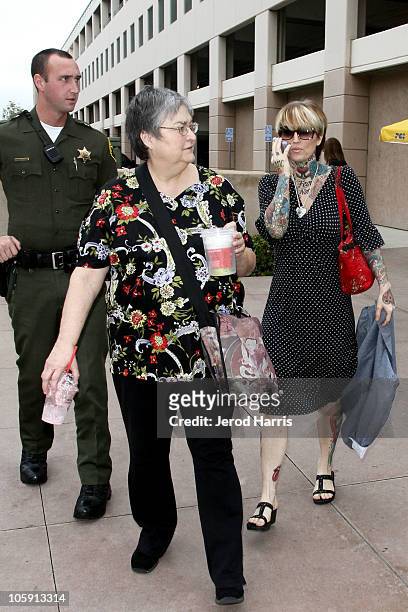 Janine Lindemulder is escorted into the Lamoreaux Justice Center by Orange County Sheriff Deputies after a confronting photographer on October 21,...