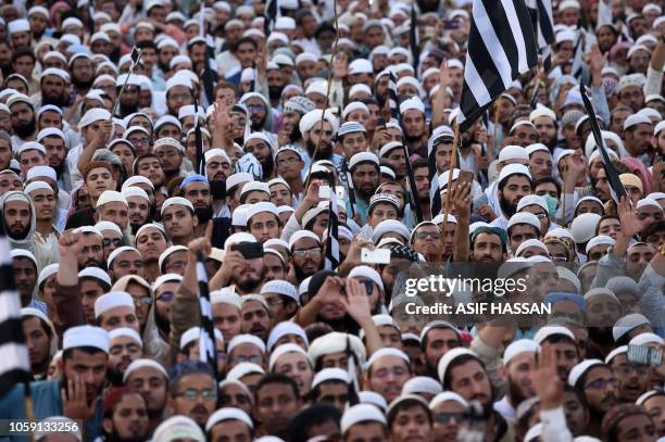 Supporters of the Pakistani religious Islamist group Mutahida Majlis-e-Amal gather during a protest rally against the release of Asia Bibi, a...