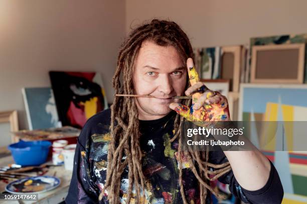 funny man with painted hand - surreal painting stock pictures, royalty-free photos & images