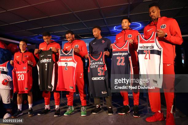 Players from Monumental Sports pose with jerseys with Geico as the jersey sponsor for the Washington Wizards, Washington Mystics and the Capital City...