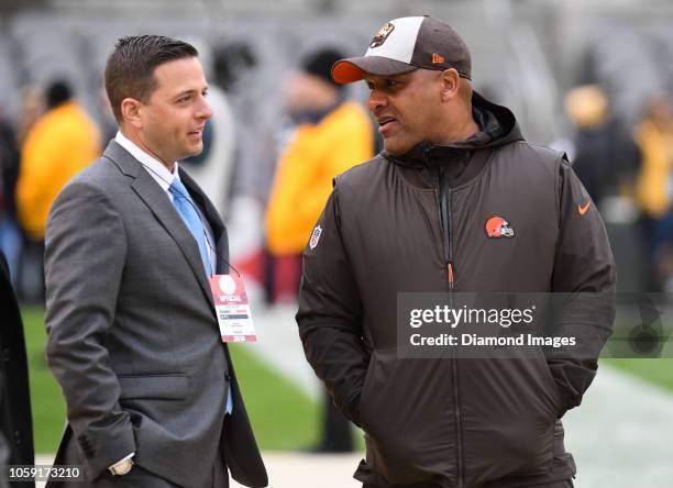 Assistant general manager Eliot Wolf and head coach Hue Jackson of the Cleveland Browns talk on the sideline prior to a game against the Pittsburgh...